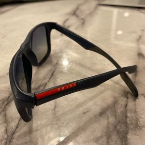 Sunglasses. Prada label. Used.  Found in woods so not sure of authenticity